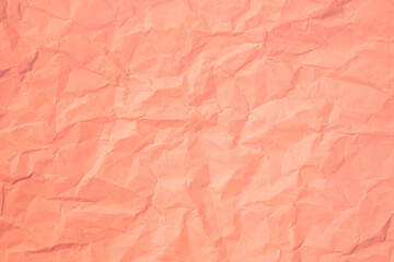 Fototapeta premium Close up of pink wrinkle crumpled old with paper page texture rough background. crease grunge parchment pattern vintage design