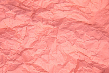 Close up of pink wrinkle crumpled old with paper page texture rough background. crease grunge parchment pattern vintage design