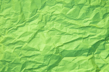 Fototapeta premium Close up of green wrinkle crumpled old with paper page texture rough background. crease grunge parchment pattern vintage design