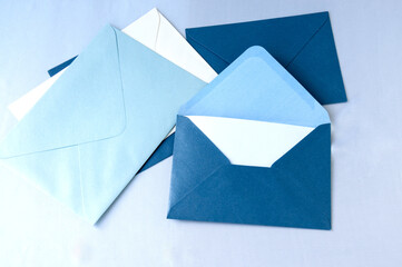 Various envelopes with letters are on the table