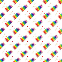 Seamless pattern of Rainbow Colored Wooden Toy 8 tone Xylophone glockenspiel isolated on white...