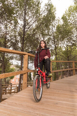Obraz premium Portrait Of A Young Man With His Bicycle.