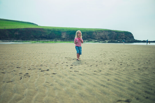 Preschooler playing on the beach