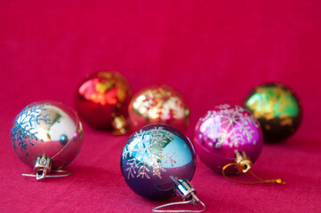 Christmas card: Christmas balls on red fabric, space for text