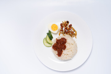 Nasi Lemak-Malaysian cuisine. A fragrant rice dish cooked in coconut milk and pandan leaf commonly found in Malaysia. A white background provides copy space