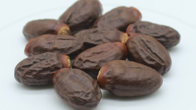 Lychee seeds on white background