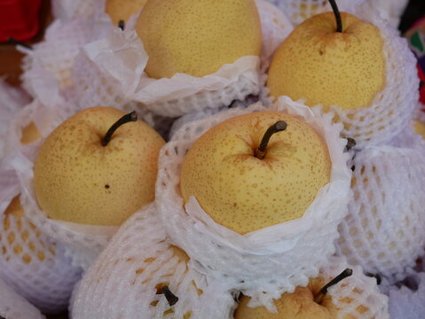 Chinese pears for sale on food market.