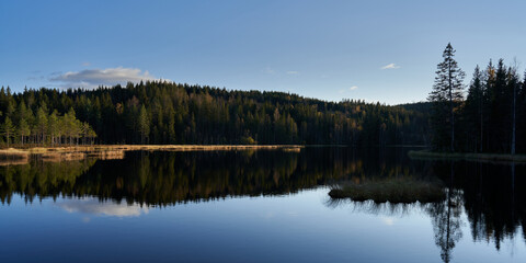 Fototapeta premium Triungsvanna, Oslomarka, Norway. Nature reserve. Shot in golden/blue hour in october. A crisp and cold evening in Nordmarka.