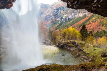 Waterfall in an autumn day in the italian alps