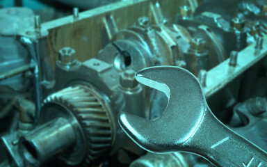 car engine and spanner. Focus on spanner