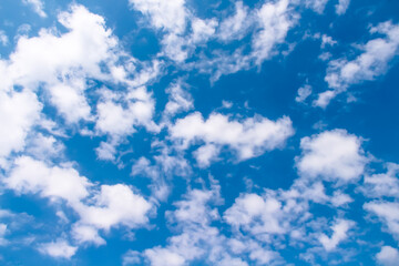 Naklejka na ściany i meble White clouds on bright blue sky outdoor summer background