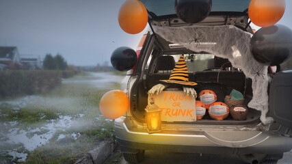 Trick or trunk. Concept celebrating Halloween in trunk of car. New trend celebrating traditional...