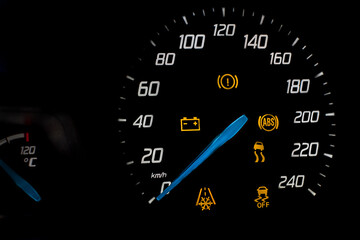 dashboard at the vehicle speed. Numbers, arrow and symbols glow on a black background.