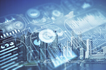 Double exposure of technology theme hologram and cityscape background. Concept of Hightech.