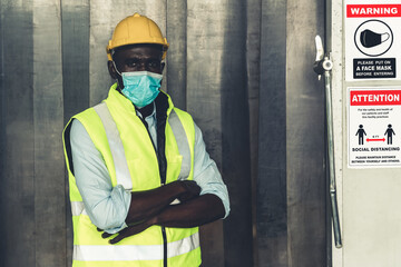 Caution sign in factory warning to industry labor worker to prevent Covid-19 Coronavirus spreading...