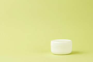 Blank white plastic container for cream, lotion, nourishing or moisturizing mask. Eco-friendly, organic cosmetology.