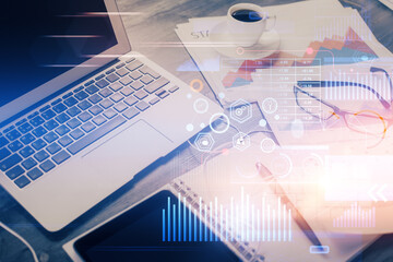 Fototapeta premium Double exposure of table with computer on background and data theme drawing. Concept of innovation.