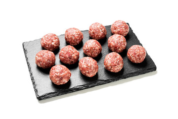 Fresh raw beef meatballs with spices isolated on white background. 