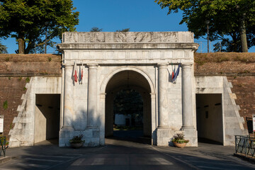 Fototapeta na wymiar Porta Vittorio Emanuele (Vittorio Emanuele city gate - 1910) entrance to the city of lucca through the fortified walls. Toscana (Tuscany), Italy, Europe