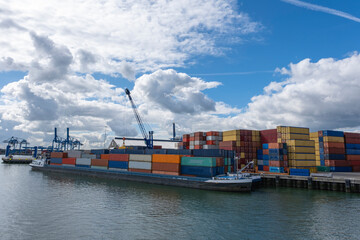 big container ships with cranes in the harbor of rotterdam netherlands