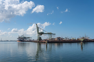 Fototapeta premium big container ships with cranes in the harbor of rotterdam netherlands