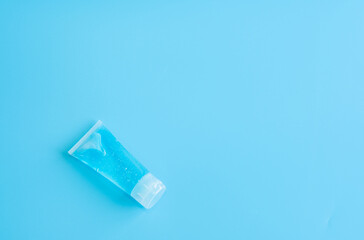 Alcohol gel for hand wash on blue background. Protection against pollution, virus, flu and coronavirus. Healthcare and medical concept. Copy space.