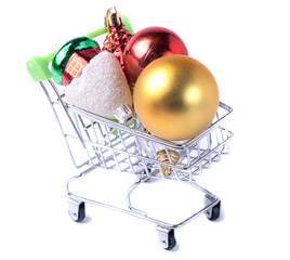 Christmas tree toys in a supermarket cart. Isolated.