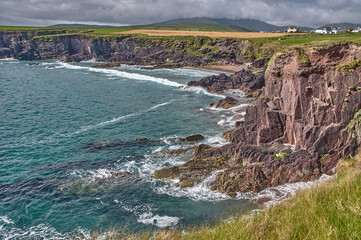 Beautiful coastline at the Ring of Kerry, Ireland. Huge cliffs at the Ring of Kerry Ireland. View on the Skellig Islands.
