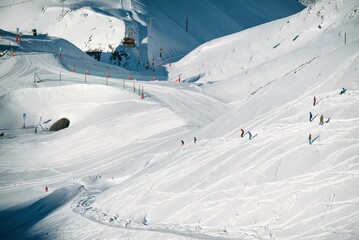 Freeride powder, snowboarding in Les deux alpes resort in winter, mountains in French alps, Rhone Alpes in France