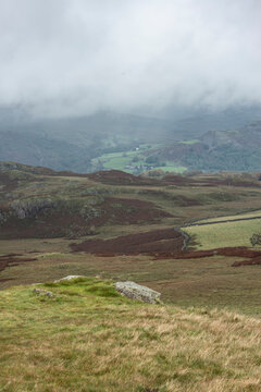 Low cloud hanging over Lake District landscape giving a dramatic image looking into the distant hills and mountains