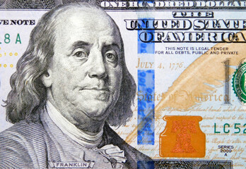 Benjamin franklin's close up image on one hundred dollar bill