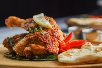 Tandoori Chicken. Indian barbecue chicken. Indian chicken dish prepared by roasting chicken marinated in yogurt and spices