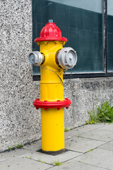 Red and yellow fire hydrant in Reykjavik street.