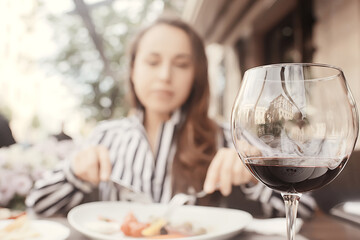 girl lunch cafe table portrait, beautiful brunette in the restaurant interior eats