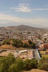 Naklejka premium The city of Heroica Puebla de Zaragoza at the foot of the Popocatepetl volcano, Mexico