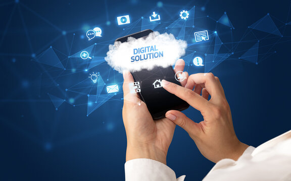 Female hand holding smartphone with DIGITAL SOLUTION inscription, cloud technology concept