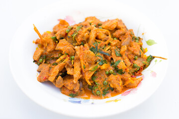 Stir fried wild boar with red curry Thai style contains with green pepper, holy basil, fingerroot, and Kaffir lime leave which they are Thai herb.
