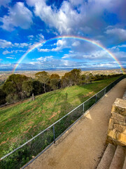 A beautiful rainbow on Red Hill top in Canberra, Australia 