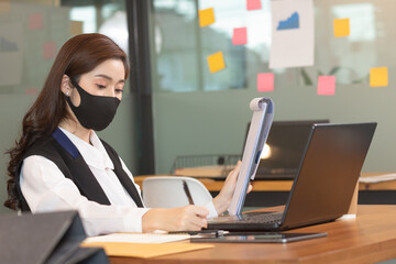 Business asian woman happy working job on laptop in office.