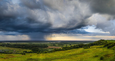 rainy clouds over the field