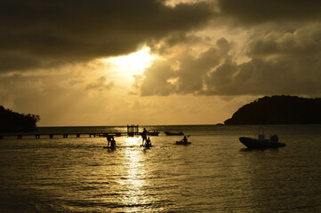 Fototapeta na wymiar Sunset over the stunning beaches of Antigua and Barbuda in the Caribbean
