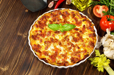 Classic Lasagne - Fast Food on wooden Background