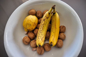 bananas and walnuts on a plate