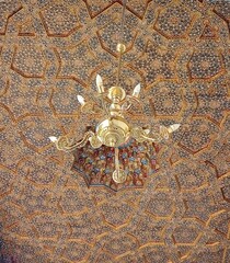 details of the ceiling outside of mosque candle and ornamental painting.