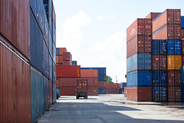 Fototapeta premium Marine and carrier insurance concept. Cargo container yard. cargo shipping container box in logistic shipping yard. colorful cargo container stacks in shipping port.