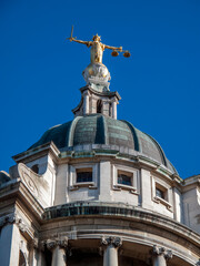 Obraz premium Scales of Justice of the Central Criminal Court fondly known as the Old Bailey London England, UK which dates from 1902 and is a popular travel destination tourist attraction landmark of the city