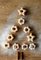 Composition with tasty  Christmas cookies on wooden background.