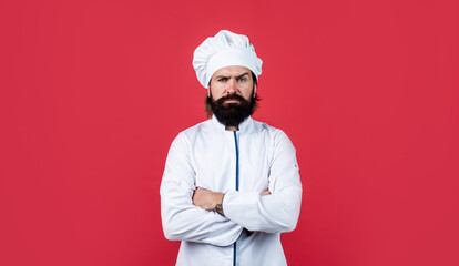 handsome hipster with beard and moustache crossed hands, culinary