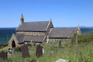 Fototapeta na wymiar The St. Mary and St. Bodfan's Church and graveyard, at Llanaber, Cardigan Bay, Wales, UK.