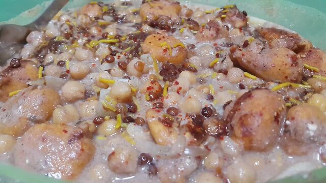 Closeup view of fresh tasty and spicy homemade channa chaat dish. Chaat is traditional dish in South Asian countries